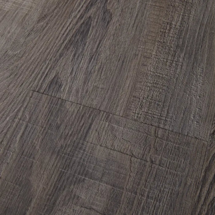 Close-up of Mannington Adura Flex Sausalito Waterfront—textured dark brown planks with visible grain and natural patterns.