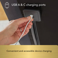 Hand plugging a USB cable into the Beauty-Rest Gold Adjustable Base’s USB A & C charging ports for device charging.