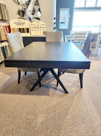 Handstone LA426 Laguna Dining Package with mid-century chairs displayed on a carpeted showroom floor.