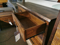 Handstone PE-28 Pemberton 8 Drawer Dresser with sculpted curves, custom metal hardware, drawer open in showroom.