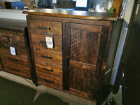 The Handstone PE27 Pemberton Gentleman's Chest with sculpted curves and metal hardware is showcased in the store.