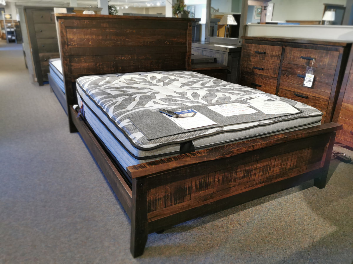 Handstone PE-QL Pemberton Q Bed features sculpted curves, custom metal hardware; mattress with price tags shown in store.
