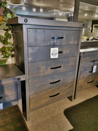 The Handstone Rafters Five Drawer Hi-boy adds rustic charm to the showroom, priced at $2,199.99.