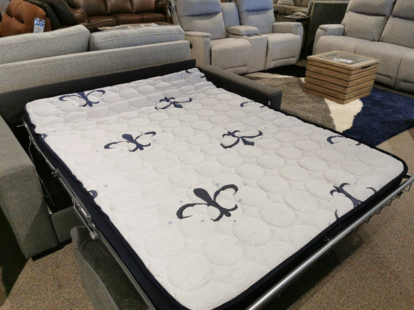 A Primo Giotto Double Sofa Bed in black and gray fleur-de-lis, with a Stearns and Foster Mattress, on display.