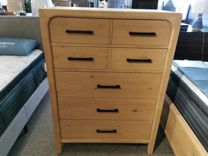 Magnussen B5684 Somerset Drawer Chest features six drawers and black handles in knotty white oak veneer.