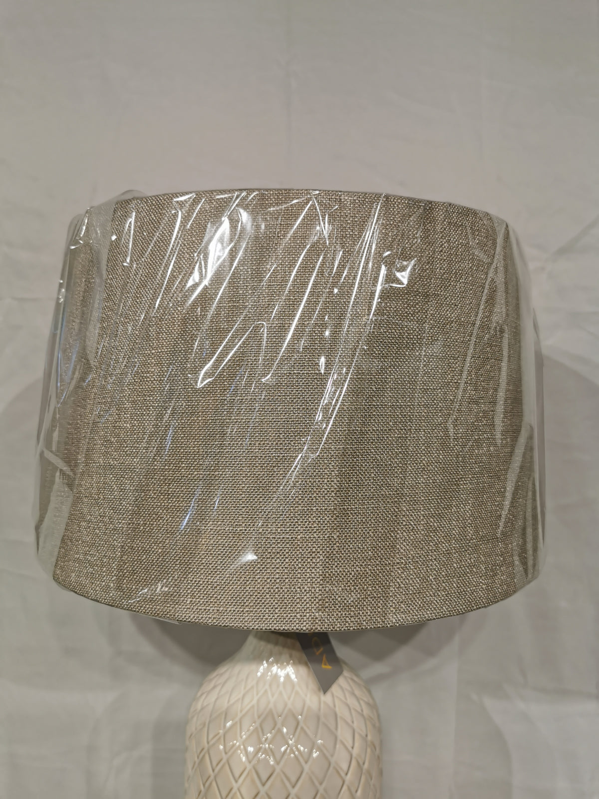 The Kathryn 2 Pack Table Lamp by Adesso Lamp features beige fabric shades and ceramic bases, perfect for elegant decor.