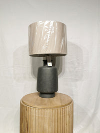 The Adesso Lamp Skylar Table Lamp delivers ambient light with modern industrial style on a round wood pedestal.