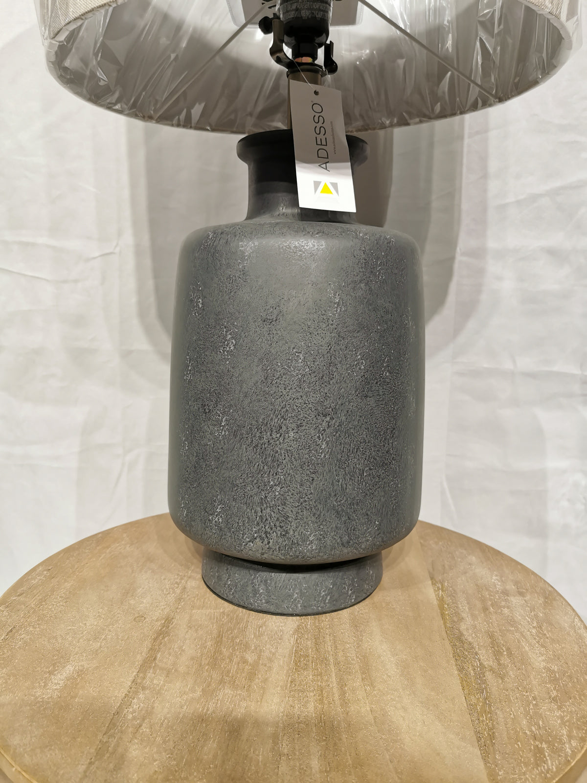 The Adesso Lamp Skylar Table Lamp features ambient lighting with a gray ceramic base and modern industrial style.