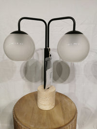 The Adesso Stockton Table Lamp has white glossed glass shades, a black finish, and a sleek cylindrical stone base.