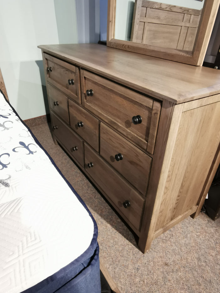 Vaughan Bassett's 123 Custom Express Dresser in driftwood grey, solid oak, with a mirror and seven spacious drawers.