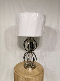 The Crestview Collection Metal 30" Table Lamp with a white shade is perfect for modern home decor.