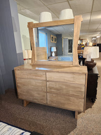 Handstone JA18 6 Drawer Dresser with mirror, light wood, shown in a showroom.