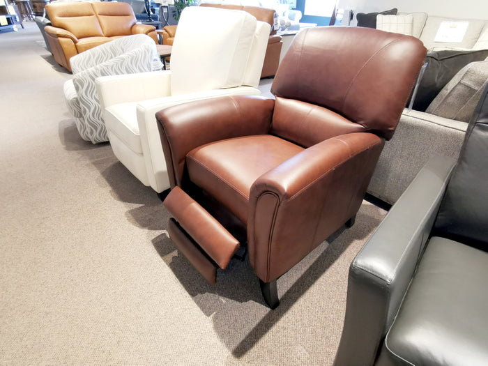 A Leather Craft 698 Reclining Chair with extended footrest is displayed in a furniture showroom.