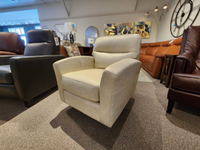The 744 Leather Swivel Chair by Leather Craft, handmade in Toronto, stands out in the showroom.