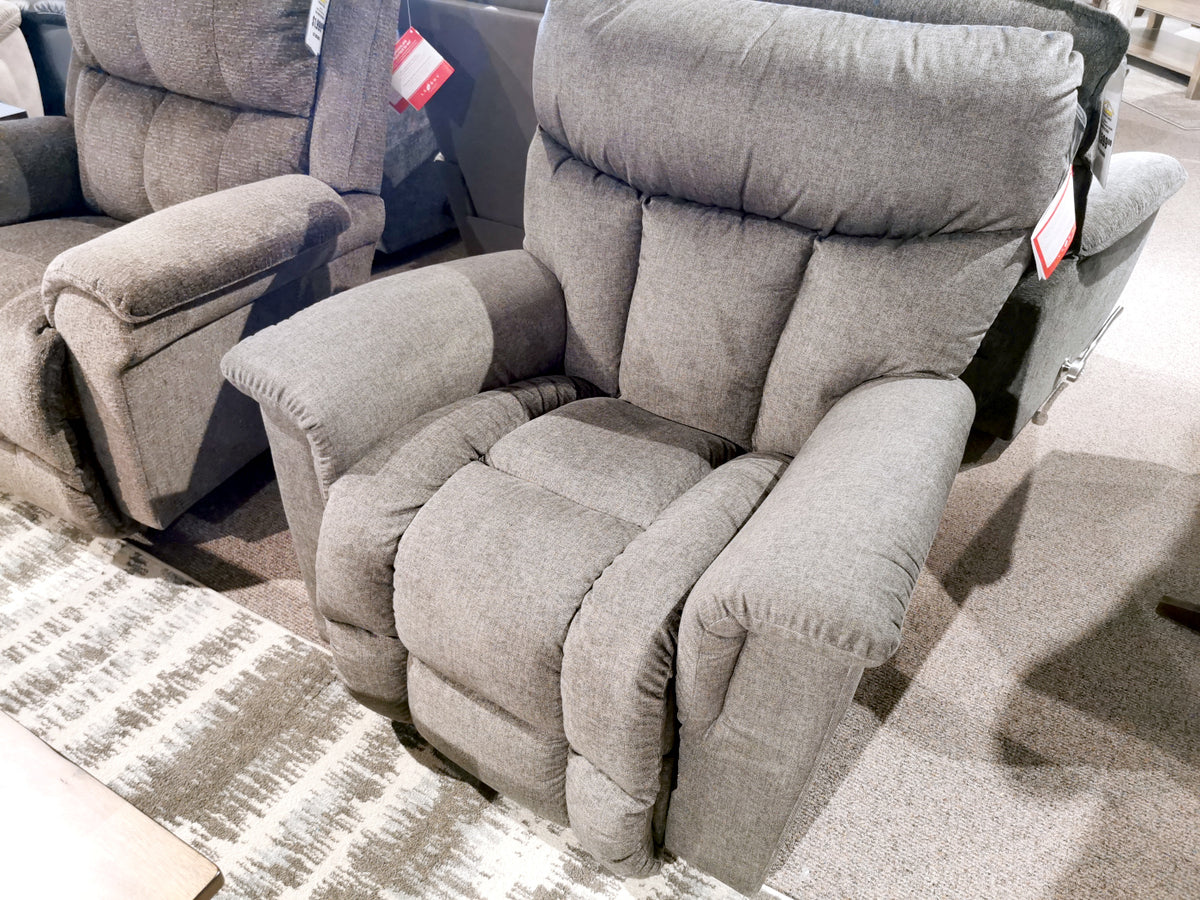 La-Z-Boy's 775 Mateo Rocker Recliner with padded armrests displayed on a patterned rug in-store.