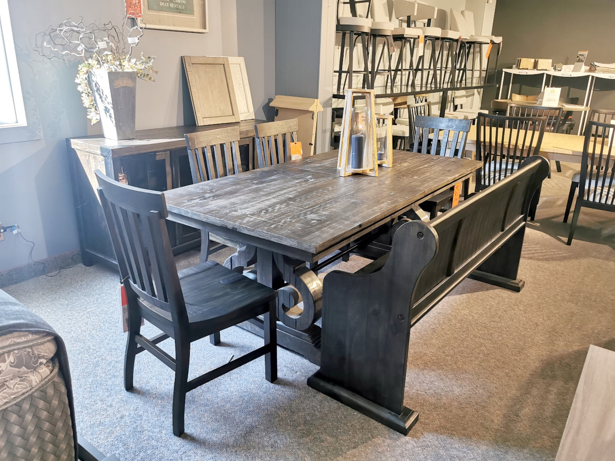 The Magnussen 2491 Bellamy Dining Package is displayed in a classically styled dining room showroom.
