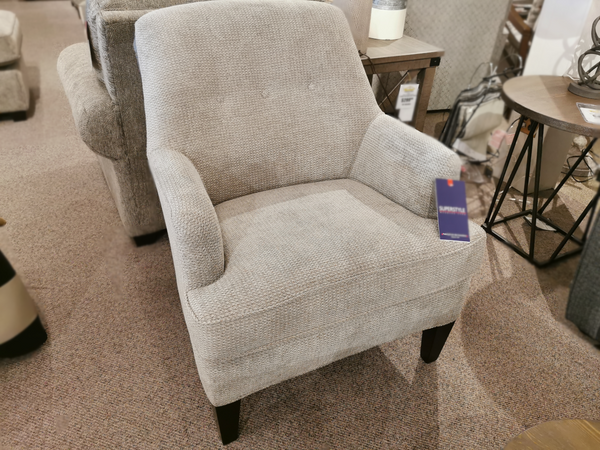 The Superstyle 31-03 Chair: Dason Stone is a light gray upholstered armchair with short dark wooden legs.