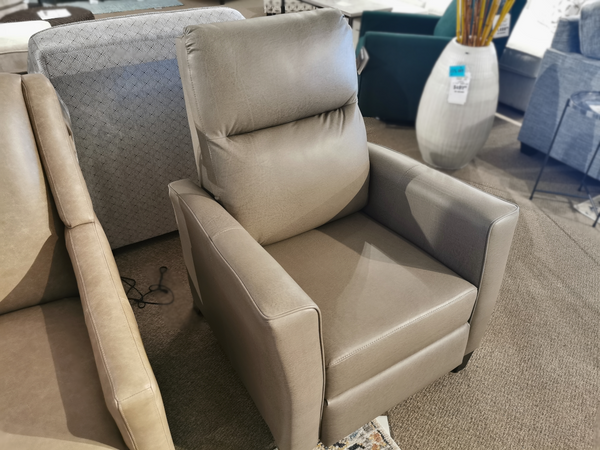 Superstyle's L35 Push Back Recliner in grey leather, with a sleek high leg design, showcased alongside other sofas.
