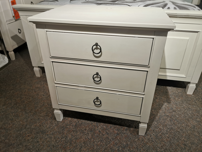 Universal 987350 Summerhill 3 Drawer Night Table by Universal, shown with metal ring handles on a carpeted floor.