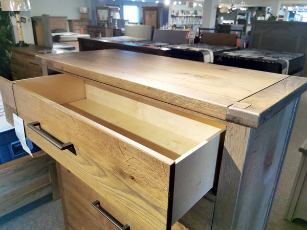 Open a drawer of the Vaughan Bassett 752 Dovetail 5-Drawer Chest, showcasing its American White Oak and smooth finish.
