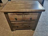 A Vaughan Bassett 801 Cool Farmhouse 2-Drawer nightstand with custom pewter pulls on a carpeted floor.