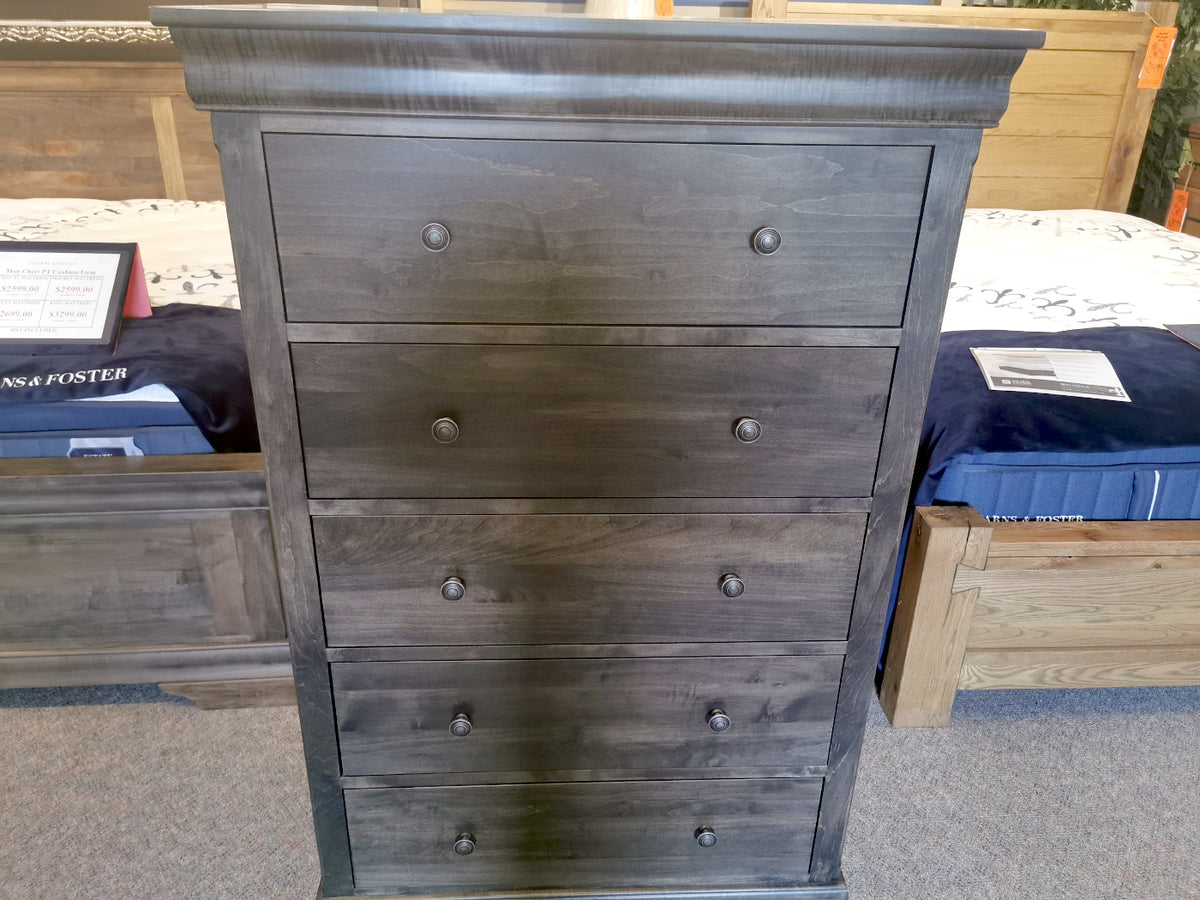 The Vokes 462 Bayshore 5-Drawer Chest, solid wood with ebony finish, is featured in the collection showroom.