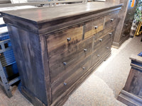 The Vokes 462 Bayshore 7-Drawer Dresser features metal knobs and is displayed on a carpeted floor.