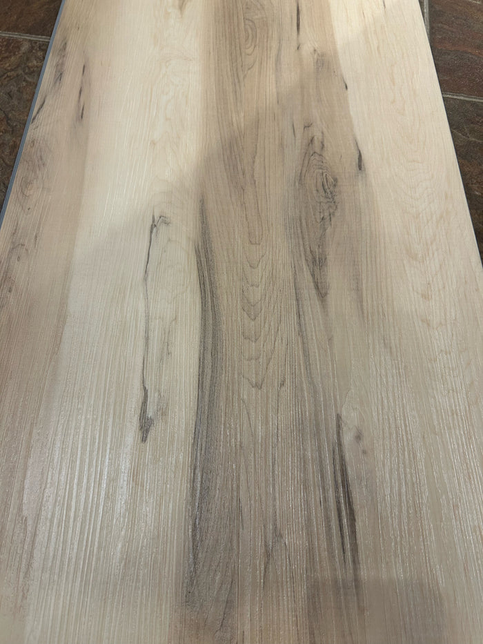 Close-up of CENTURA KARNDEAN RIGID CORE SCB5526 click vinyl plank with light wood grain and natural dark streaks.