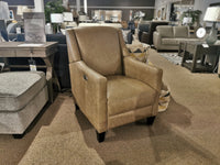 The Decor-rest 3053 Leather Power Recliner, featuring a tan color with wood legs and a high back, is on display in a furniture store amidst an array of sofas and tables.