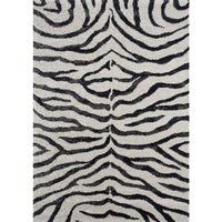 The Kalora Sable 9652/P384 rug features a bold vertical black and white zebra pattern for a chic, modern look.