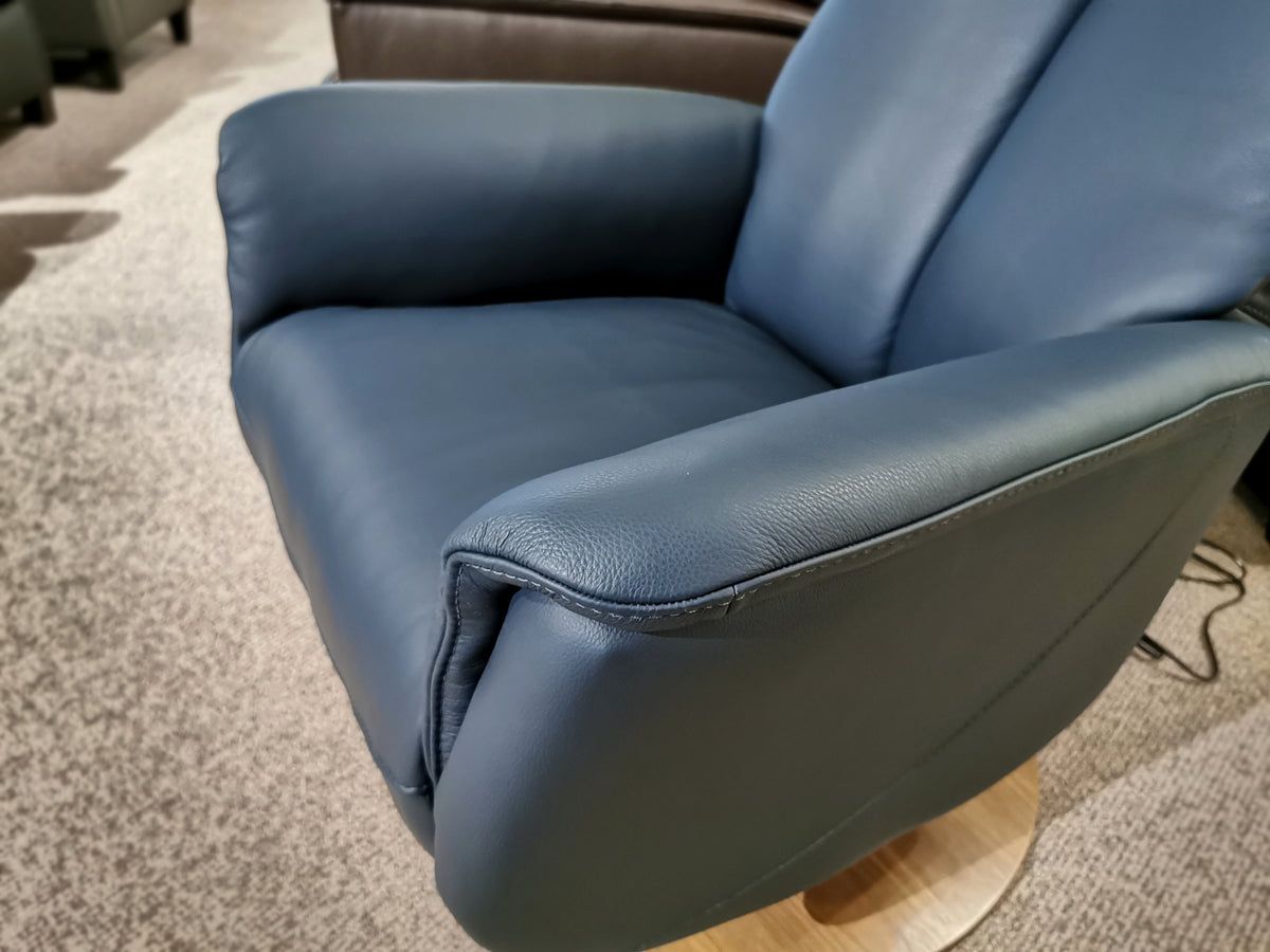 50030 Q30 Leather Swivel Recliner by Palliser: A comfy blue armchair with a wooden swivel base for carpeted floors.