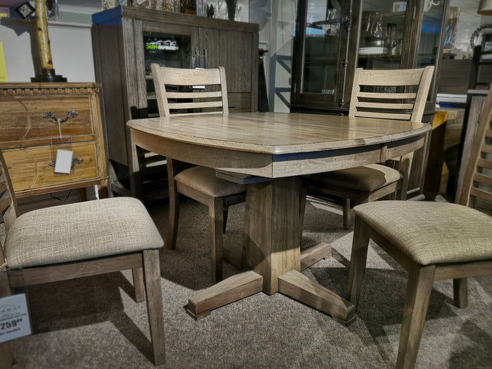 The Winners Only Ventura Pedestal Table set includes a round solid hardwood table and four chairs in grey washed finish.