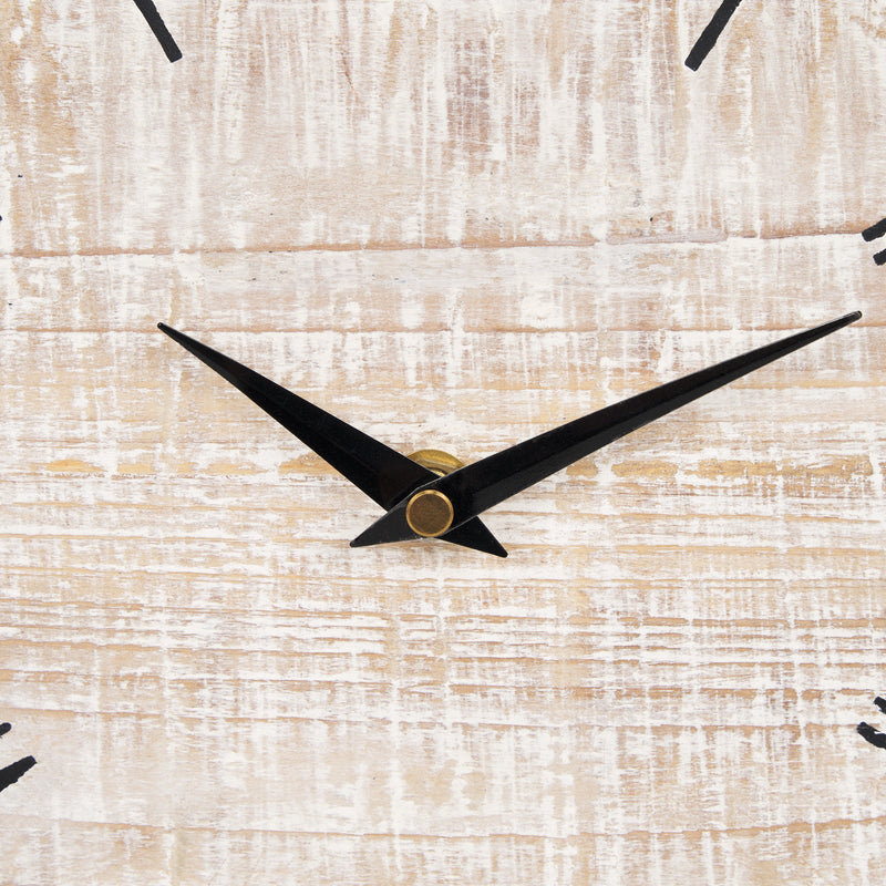 The Mercana 70692 Raja Table Clock features matte black hands on a textured whitewashed face, set to 8:10.