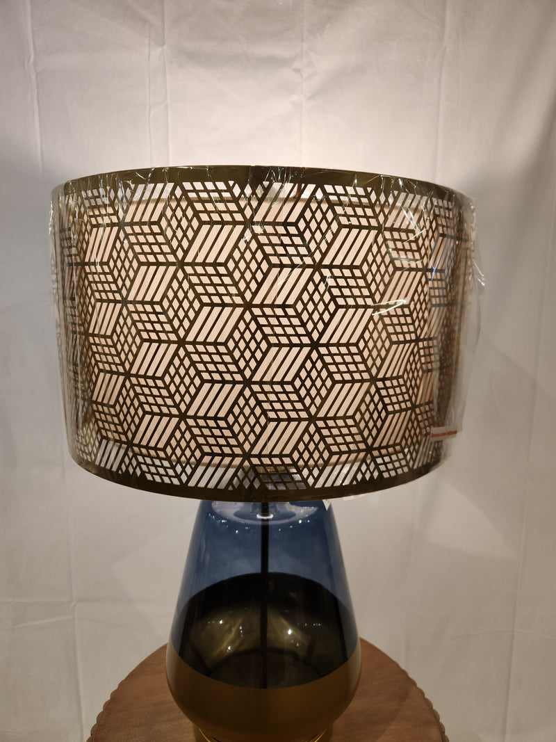 The Pacific Coast 87-08448-51 Taurus Table Lamp features a blue glass finish and geometric shade for stylish decor.
