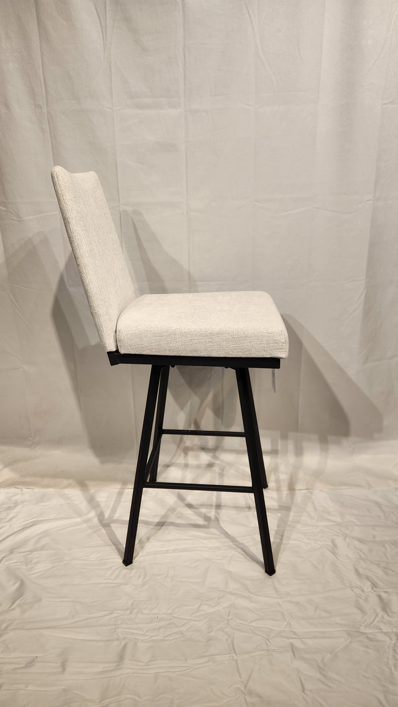 Side view of Linea Swivel Bar Stool by Amisco with light gray cushion and black metal frame on a white background.