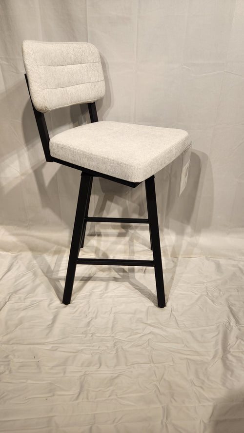 Amisco's Phoebe Counter Height Swivel Bar Stool in light gray features black legs and backrest on a light fabric.