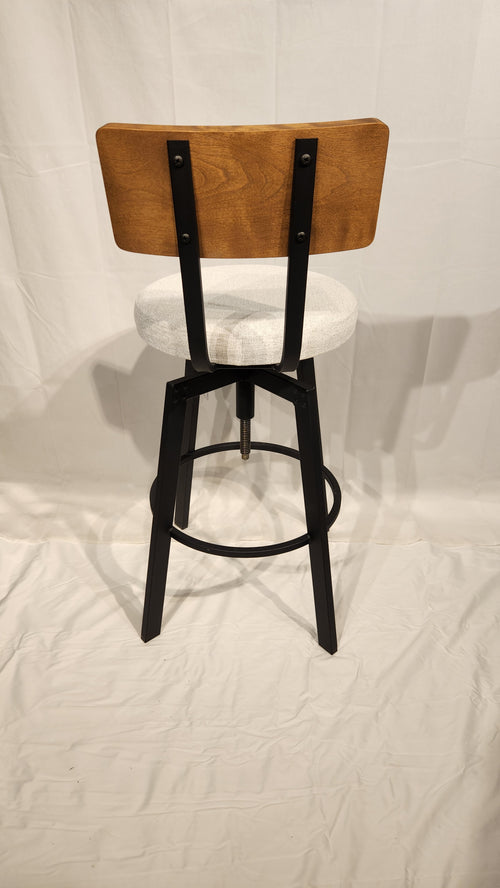 The Architect Black Coral Counter Height Stool by Amisco embodies minimalism with its wood back, white seat, and black legs.