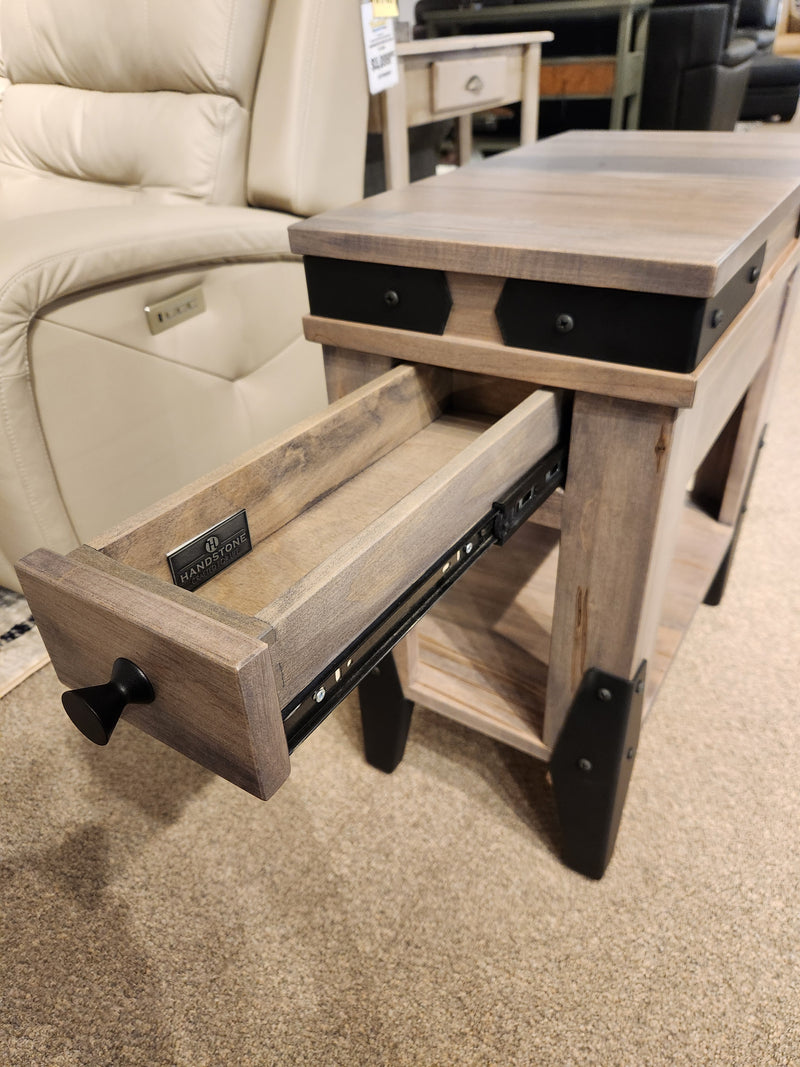 The Handstone N-CH2313 Chattanooga Chairside End Table sits by a beige chair, blending classic style on the carpet.