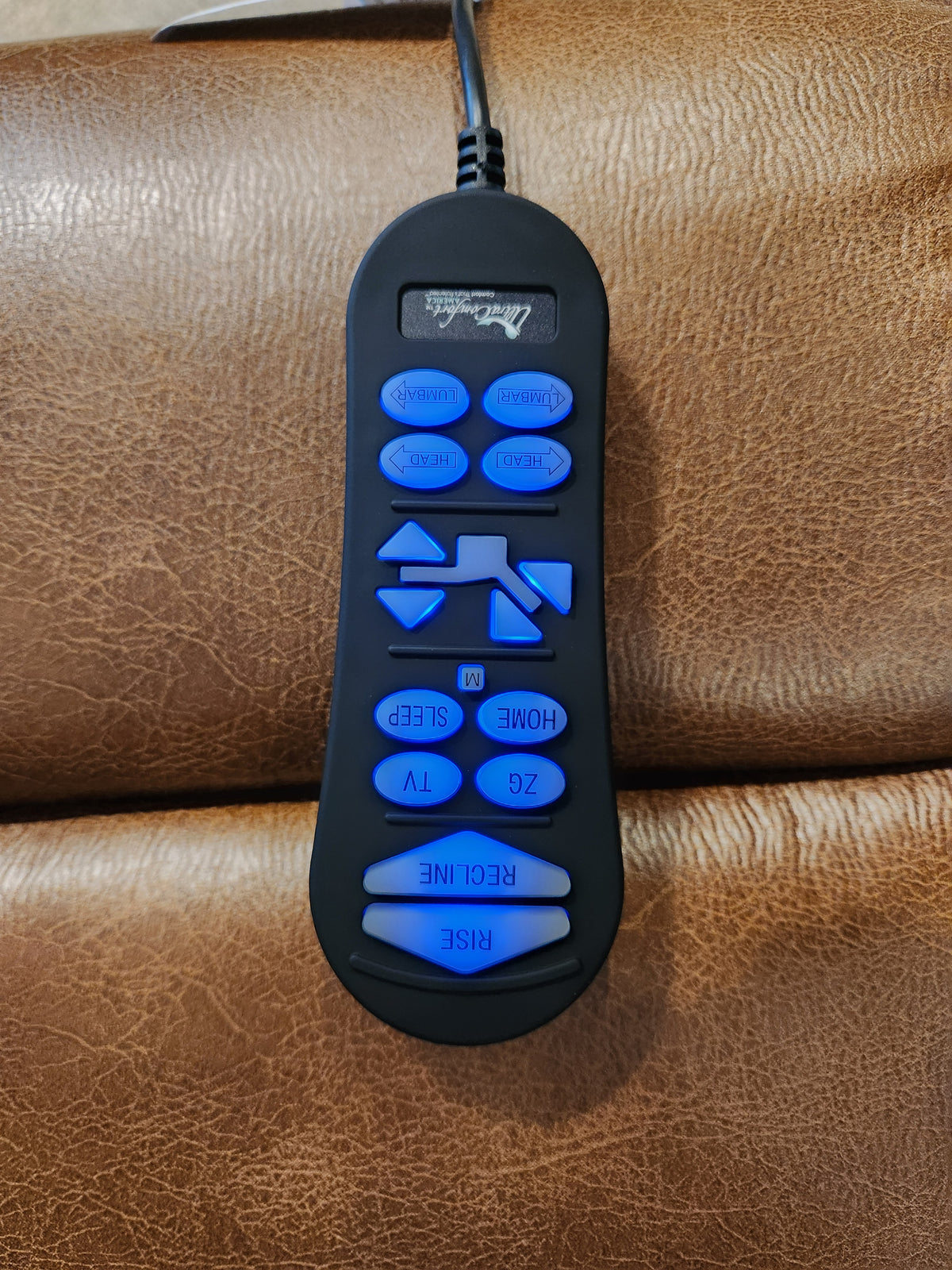 Rhodes UC-472-MED by Golden: Black power lift recliner remote with blue backlit buttons, 4-Zone design, on brown leather.