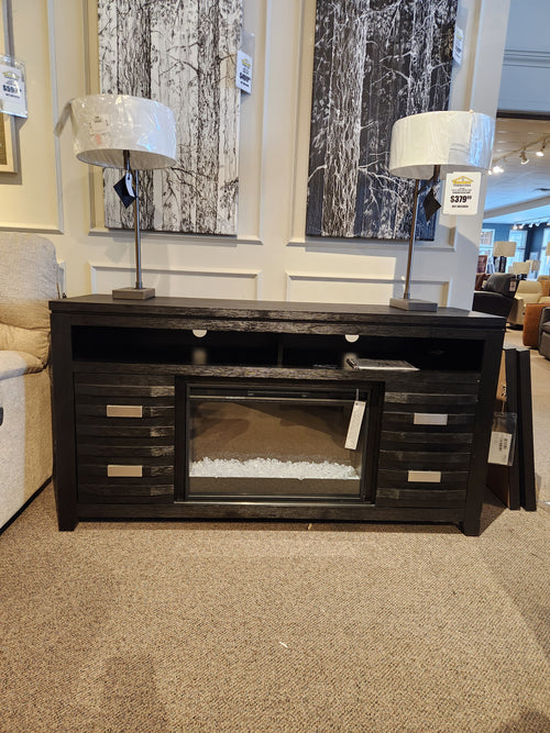 Altamonte Electric Fireplace Mantel by Jofran with wall art and two lamps, creating a cozy ambiance.
