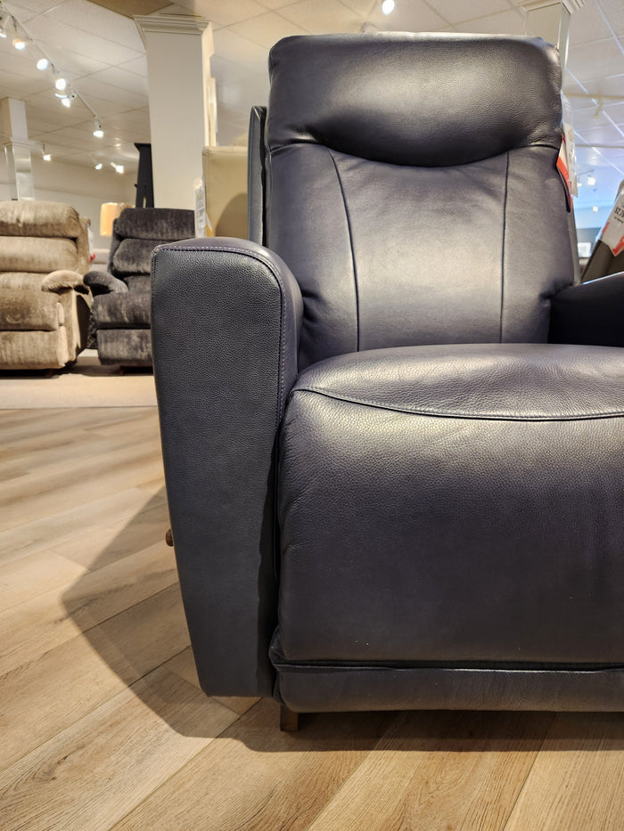 La-Z-Boy 715 Kodie Recliner in dark blue leather offers supreme comfort on wood floor with other recliners around.