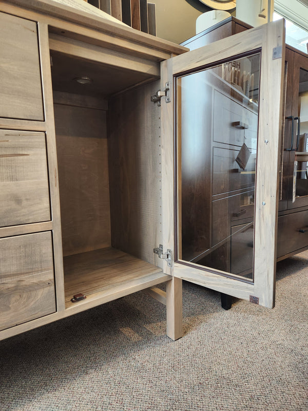 The Handstone Brooklyn Dining Sideboard with Pot Lights has glass doors, empty shelves, and drawers for compact homes.