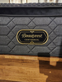 A close-up of a Beauty-rest Hermes Ultra Plush Mattress with quilted pattern, logo label, and micro coils.