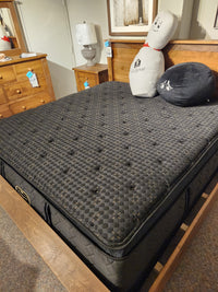 A Beauty-rest Hermes Ultra Plush Mattress with latex foam on a wooden frame, plus novelty pillows and furniture.