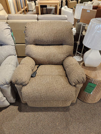 The Best 7MP84 Ellisport Power Space Saver Recliner with remote, in brown, is shown in a furniture showroom.