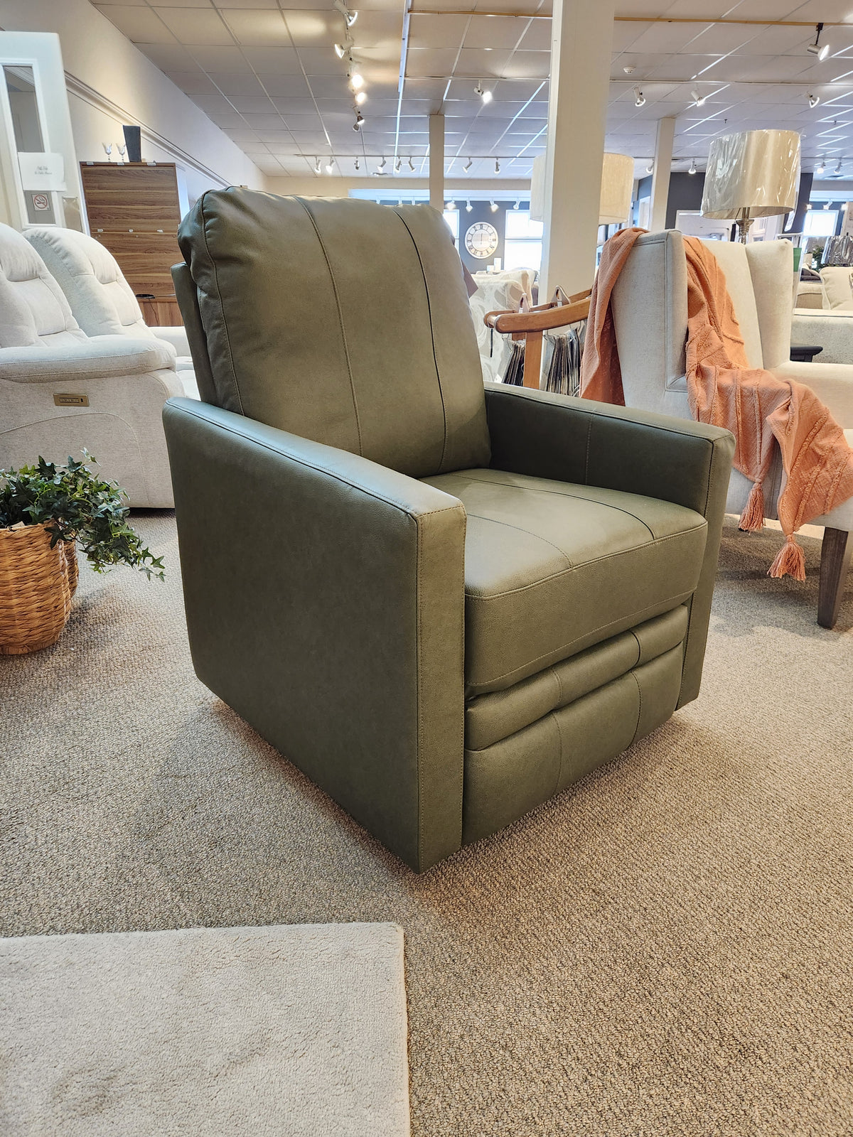 Best's Kristisha Swivel Push-back Recliner in green, featuring a triple back design, on display in the store.