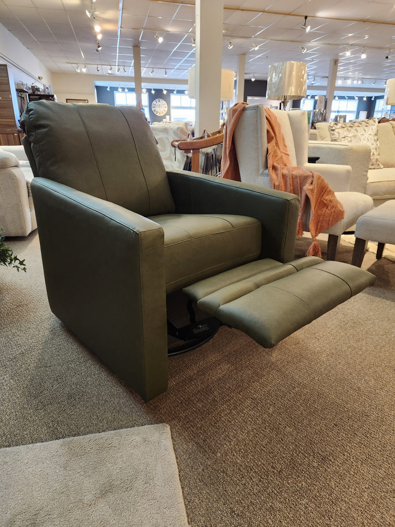 Green Giana Swivel Push-back Recliner by Best, featuring a triple back, displayed on a carpeted floor.