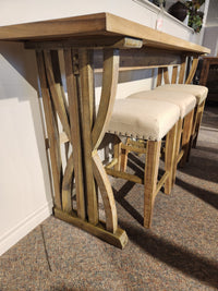 Jofran 1933-74 Fairview Counter Table with 3 stools on carpet, chevron top, linen-blend seats, against a wall.