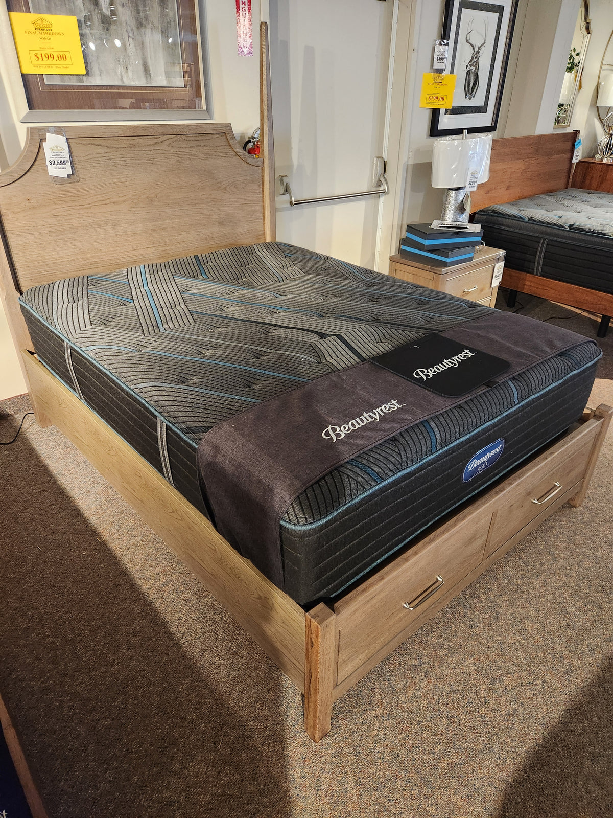 A wooden bed frame with storage drawers and a Beauty-rest Mira TT Medium Mattress with pocket coil system.