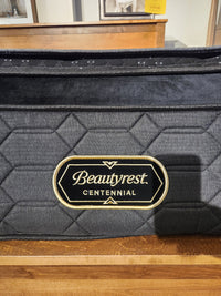 A black Beauty-rest Apollo PT Medium Mattress with pocket coils, geometric stitching, and branded side label.